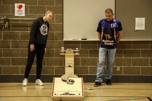 People play cornhole