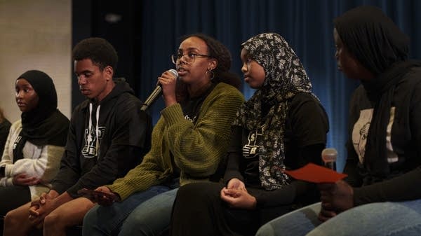 Students addresses the audience during a event