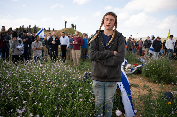 As Israeli police keep watch, some protesters pray at a field in Kerem Shalom in southern Israel, just across the border from Gaza.