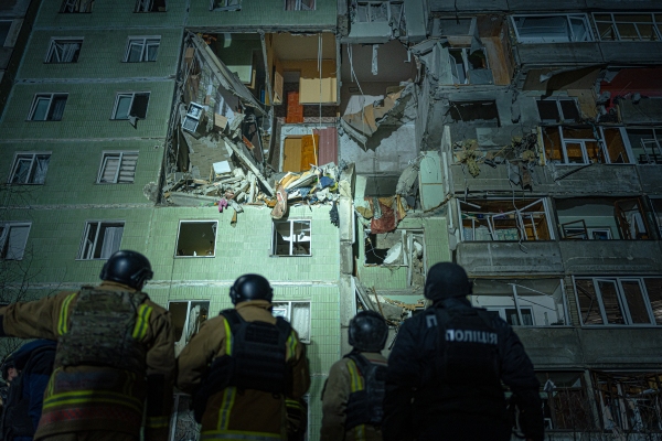 Rescue team in front of damaged residential building in Sumy just after strike of Russian kamikaze drone Shahed. 9 apartments completely destroyed, 11 persons killed, 14 injured on 30 Jan 2025 Images: @shtukaanton - Anton Shtuka/NPR