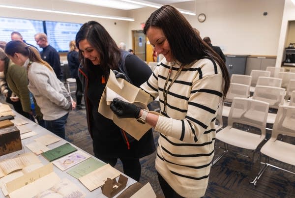 People examine documents 