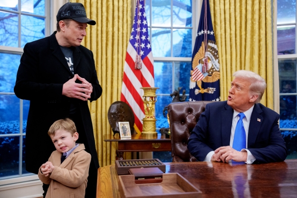 President Trump is joined by Tesla and SpaceX CEO Elon Musk, and his son, X Musk, during an executive order signing in the Oval Office at the White House on Feb. 11, 2025.