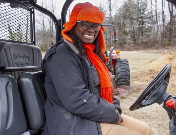 February 6, 2025 Farmer Gale Livingstone in a tracker trailer at Deep Roots Farm in Upper Marlboro, Maryland. Photo by Dee Dwyer for NPR