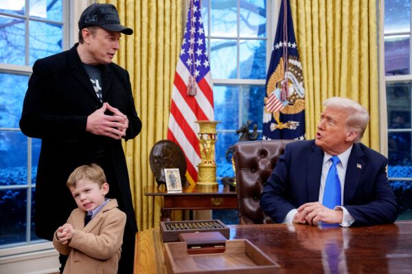 President Trump is joined by Tesla and SpaceX CEO Elon Musk, and his son, X Musk, during an executive order signing in the Oval Office at the White House on Feb. 11.