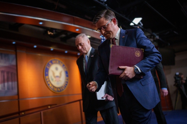 Speaker of the House Mike Johnson, R-La., departs a news conference alongside House Majority Leader Steve Scalise, R-La., at the U.S. Capitol on Tuesday. House Republicans are working to pass a budget bill this week that ncludes up to $4.5 trillion in tax cuts, an increase in the debt limit and cuts Medicaid and other social programs. (Photo by Andrew Harnik/Getty Images)