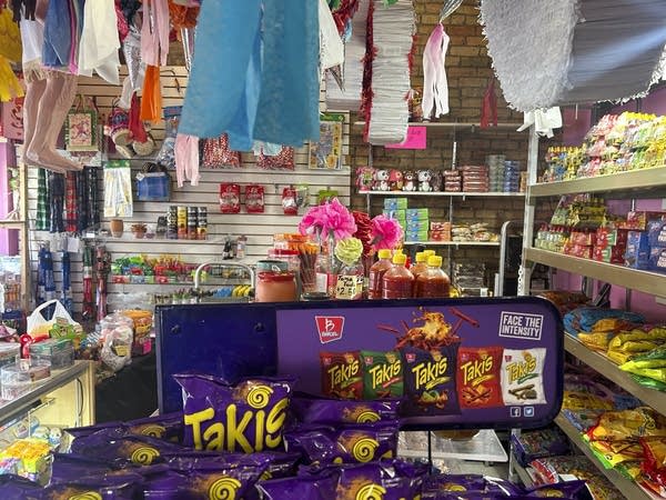 Candy and partially seen pinatas inside the Dulceria La Pinata