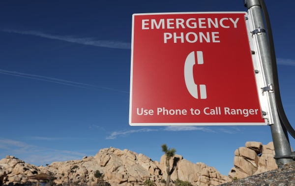 A sign for an emergency phone in California's Joshua Tree National Park.