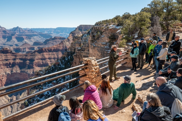 A ranger gives a tour to visitors at the Grand Canyon.