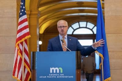 A man speaks to a crowd at the capitol