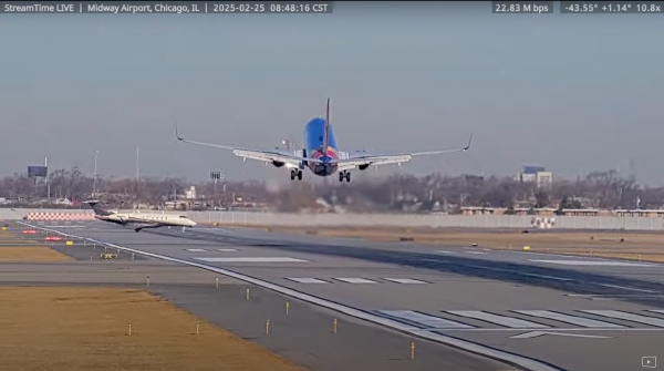 A screenshot from the StreamTime Live account on Youtube of the near collision between a Southwest 737 plane and a private business jet.