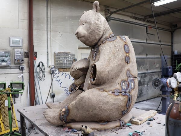 a partially assembled bronze bear statue