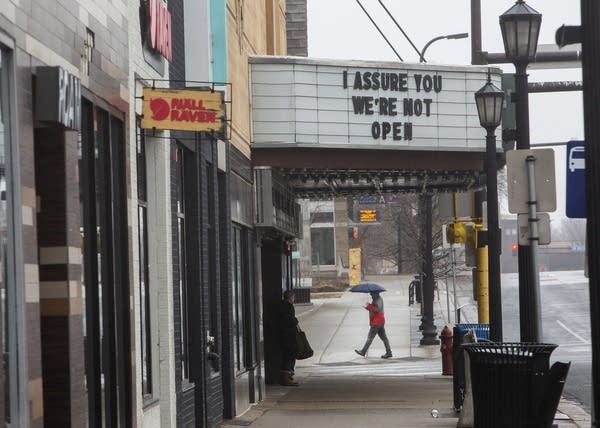 A movie marquee reads "I assure you we're not open."