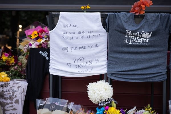 A hand-written memorial on a white tank top