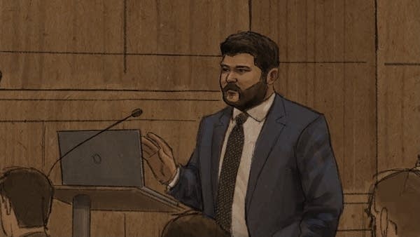 Man gestures in courtroom