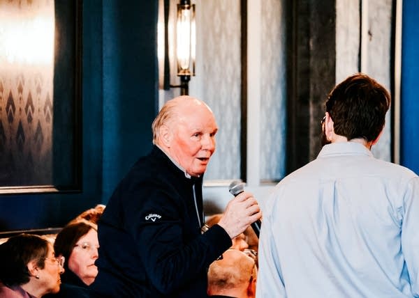 a man speaks to an audience