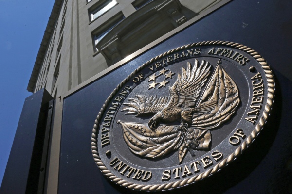 The seal of the Department of Veterans Affairs is seen outside the agency's building in Washington, D.C. The VA says it will no longer offer medical treatment for gender dysphoria to veterans.