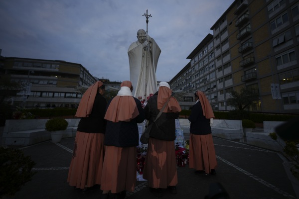 Nuns pray for Pope Francis on Saturday in front of the Agostino Gemelli Polyclinic in Rome, where the pontiff is hospitalized.