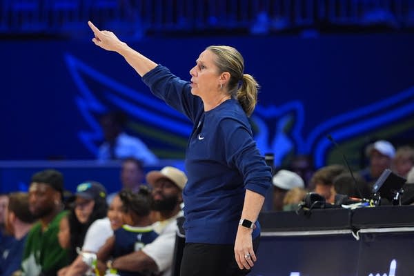 Cheryl Reeve gestures during a game