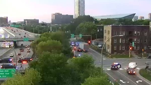 A traffic camera image of a crash involving a car and a semi
