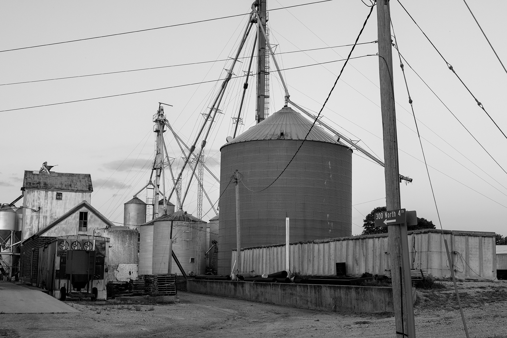 Grain elevator and other farm buildings.