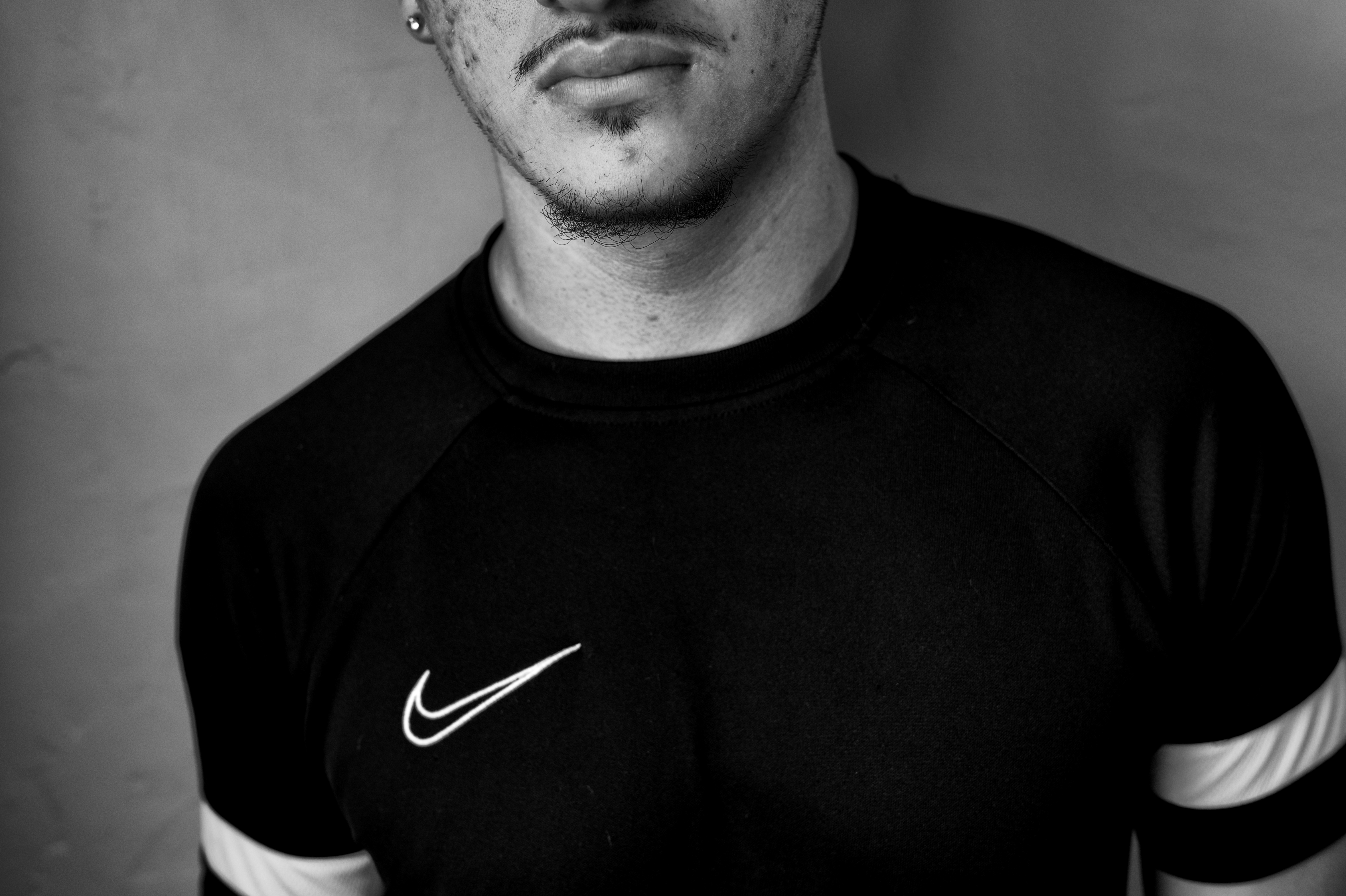 Close-up portrait of a man in a Nike shirt.