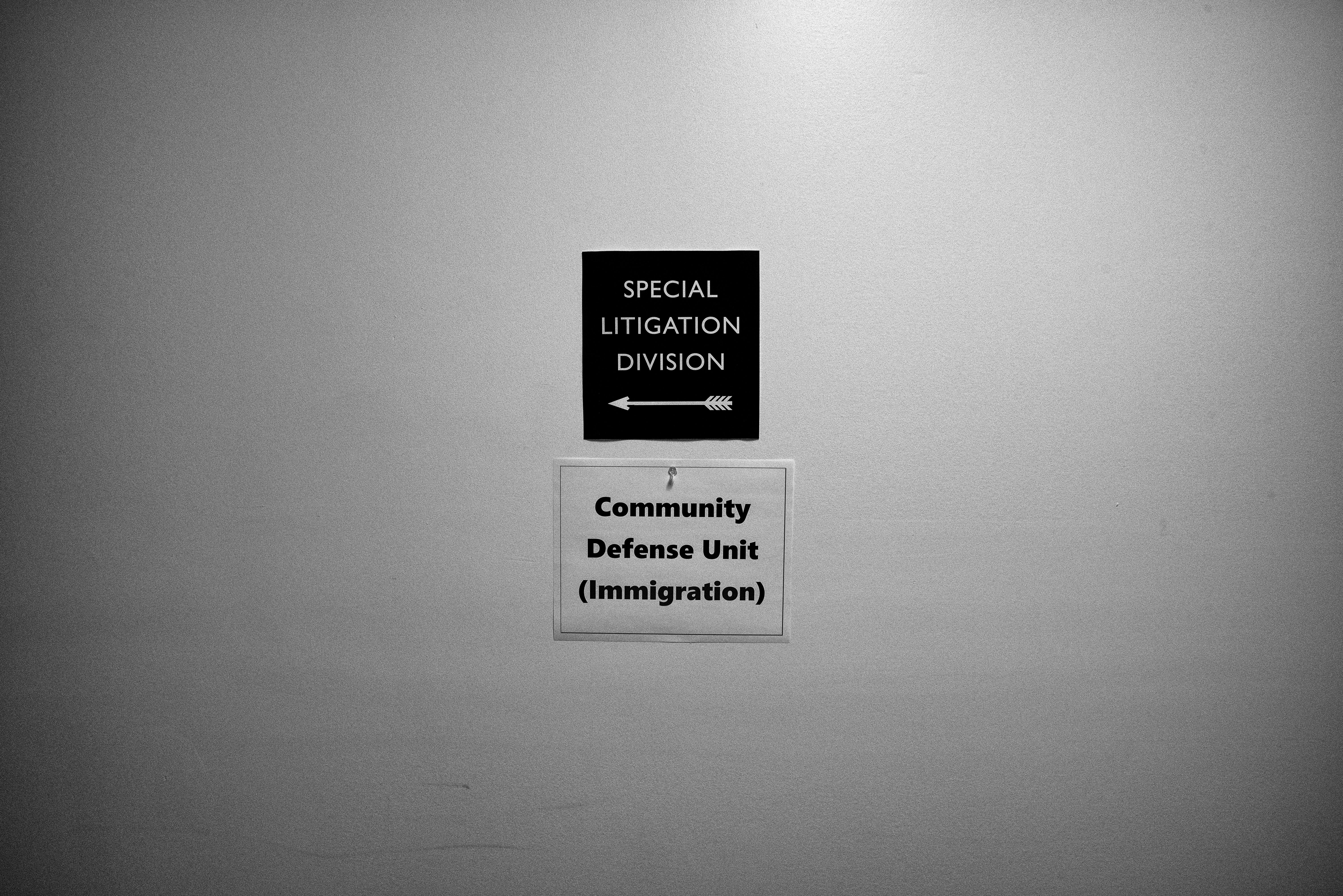 Small sign on a wall that reads "Special Litigation Division."