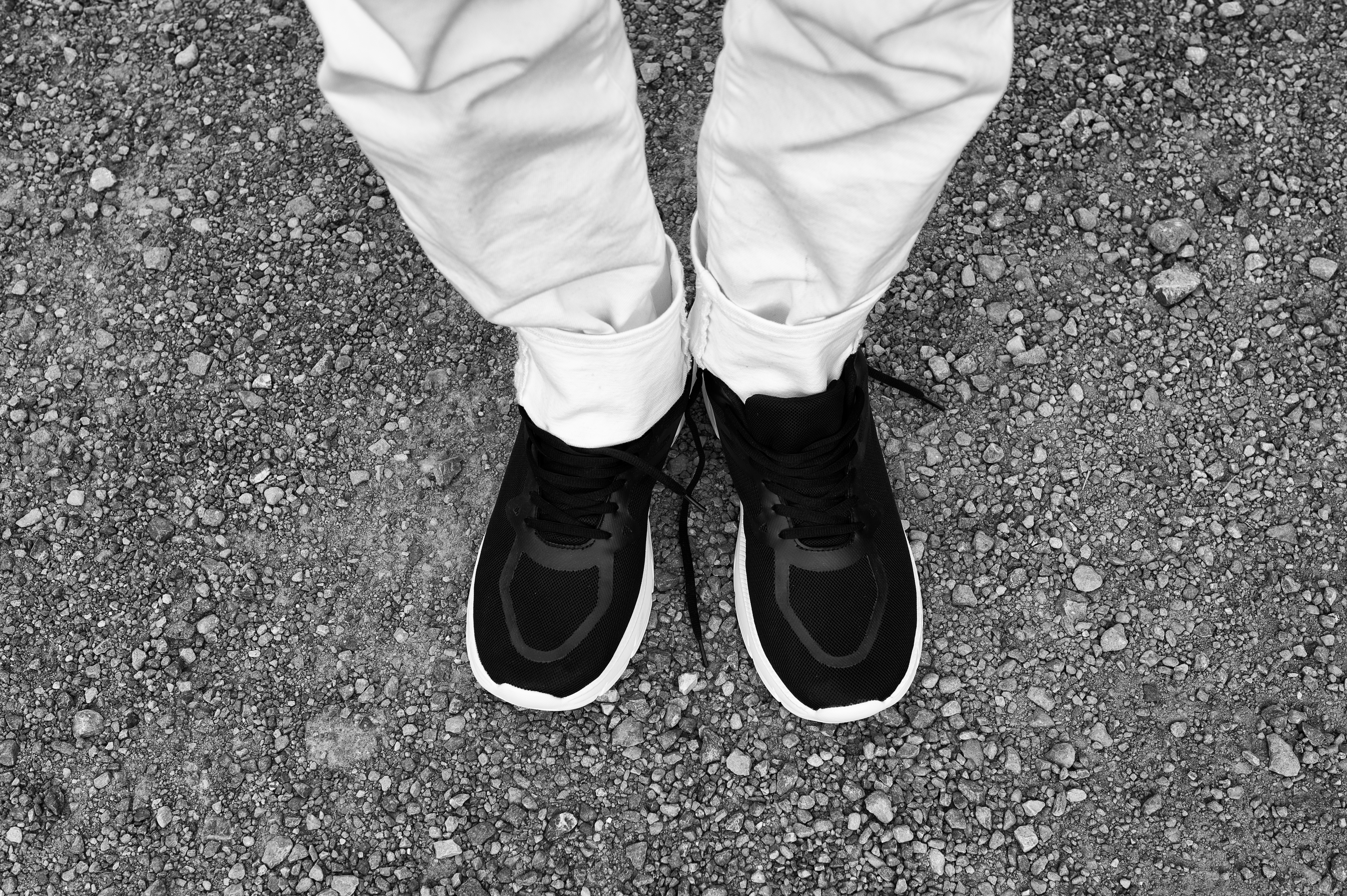 View of person's feet, wearing close-toed shoes.