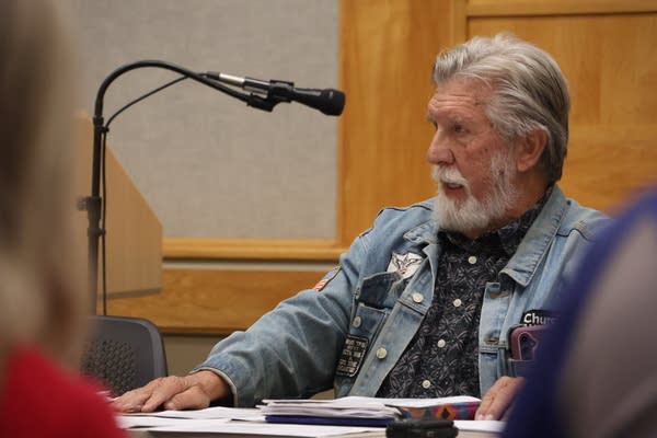 A man speaking at a work session