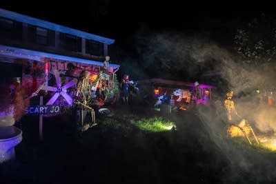 Fog swirls around a Halloween display