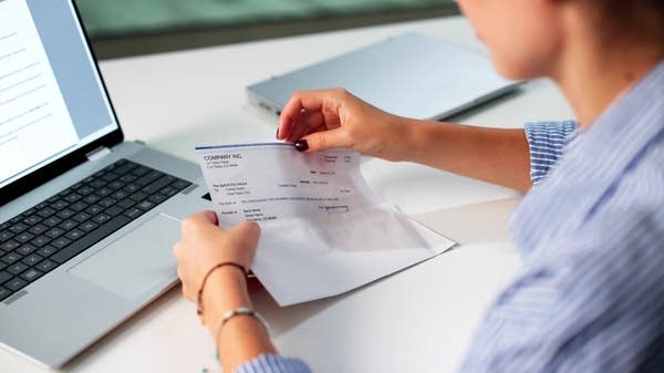 woman handling a paycheck
