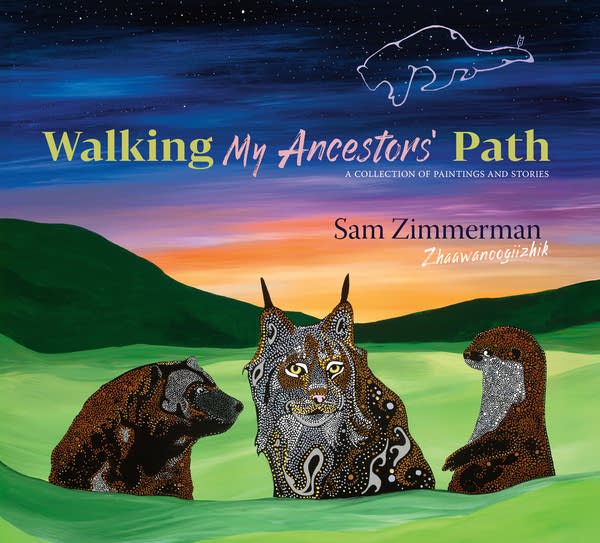 A book with art of three wild animals under a twilight night sky.