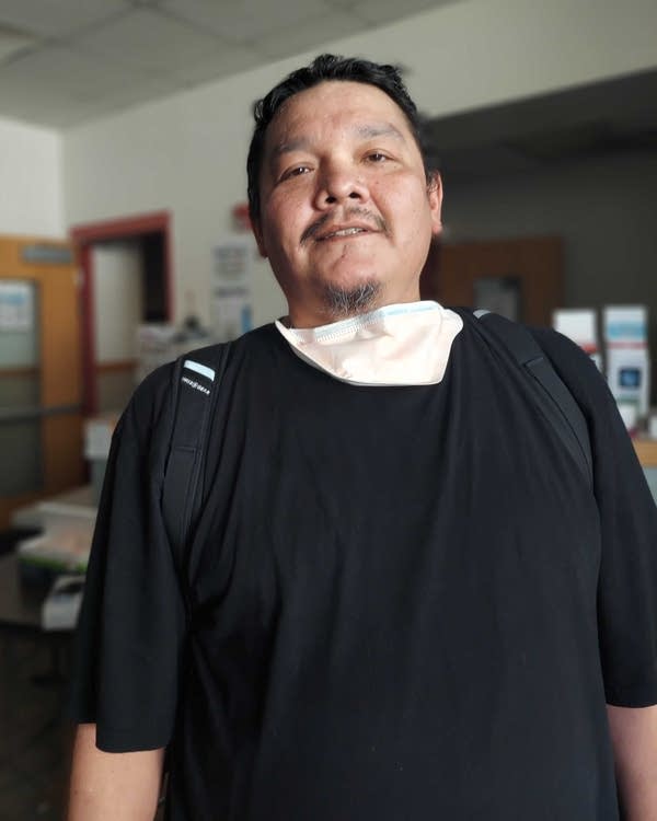 A man in a black T-shirt